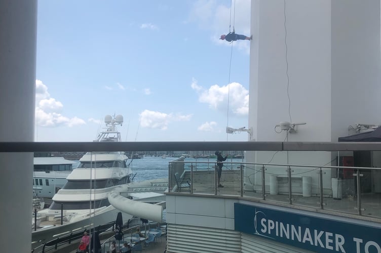 June Fenn abseils down the Spinnaker Tower at Gunwharf Quays in Portsmouth on June 15th 2025.