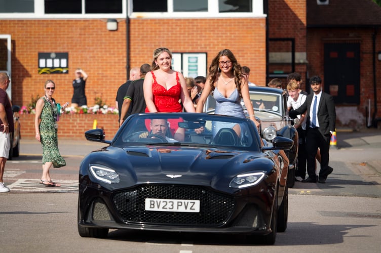 Making an entrance at their Prom in an Aston Martin convertible, Matilda Spink and Lizzie Naylor
