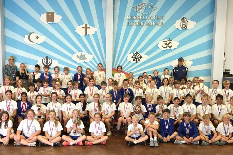Pupils at Horsell C of E Junior School celebrate a record-breaking year of sporting success across rugby, cricket, netball, athletics, swimming and more