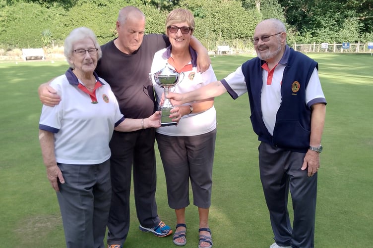 Robert Hills presents the Ron Cheeseman Triples trophy to Sheila Challinor, Steve Lewington and Daniela Cousins