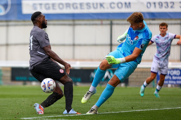 Inih Effiong challenges Callan McKenna for the ball (Photo: Phil Fiddes)