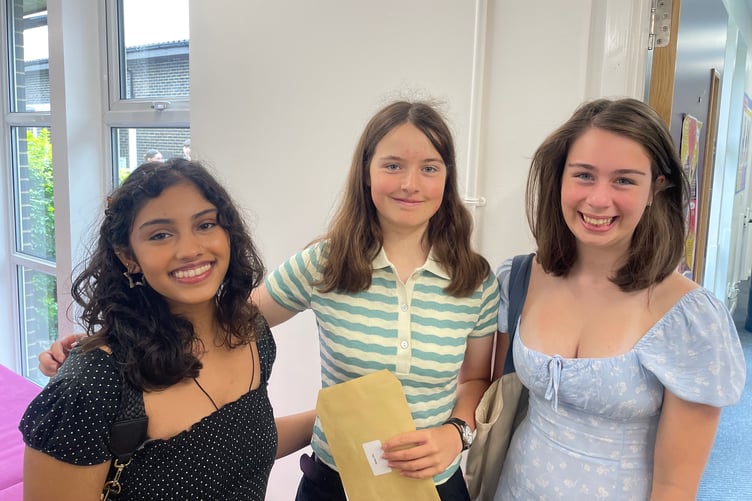 Nicole de Souza on the left proud of achieving a 9 in her English Language