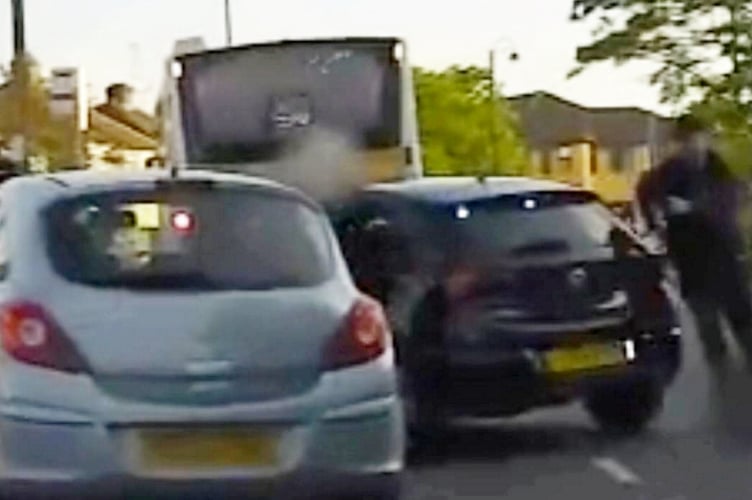 Joshua Olatunboson was captured on camera throwing drugs from his car window. A drug dealer has been caught throwing a bag of cocaine out of a car window - in a bid to get rid of the evidence. Footage shows Joshua Olatunboson, 25, being caught red-handed attempting to discard drugs. His black bag full of coke and be seen flying through the air as cops swoop in. Officers stopped Olatunboson in his Vauxhall Corsa in Hersham in Surrey when he was seen to throw an item from the window of his car. A black discarded bag located nearby was found to contain a white powder - suspected to be cocaine. Olatunboson was arrested on suspicion of being in possession of a Class A substance with intent to supply, breaching a suspended sentence already in place. Following a search of an address linked to Olatunboson, over 78 grams of cannabis was seized along with £2,140 of cash and drug paraphernalia including scales, all indicating that Olatunboson was involved in the supply of drugs. When officers searched Olatunbosons phone, messages were found consistent with the supply of drugs, and Olatunboson was later charged with the drug-related offences.
