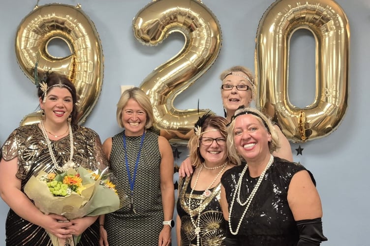 Woking Day Care Manager, Fran Simpson (left) with Chief Executive, Rachel Hill and the Care Team at the 1920s Summer Party