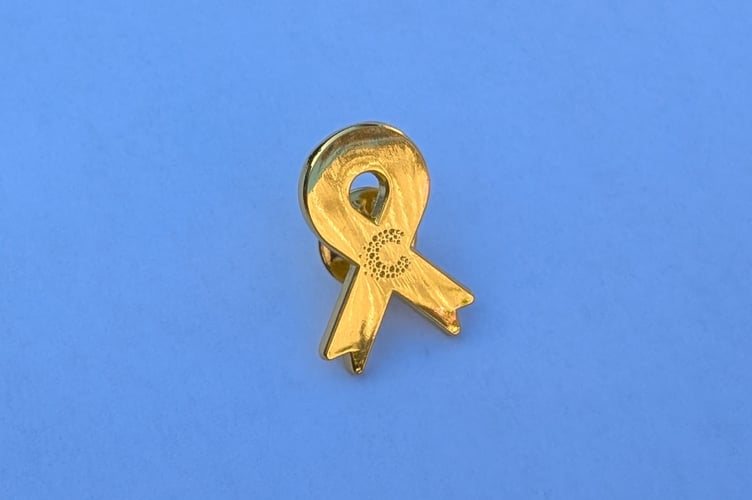 Cancer Research UK gold ribbon badge 2