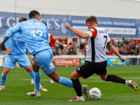 Point apiece after breathless encounter in windswept Woking