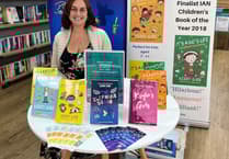 Author signs up to helping hospice