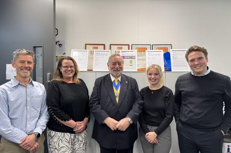 Pictured at the official opening are Councillor Betton (centre) and from left to right Alastair Shanks, Claire Skilton, Keleigh Loveday and Rhys Bailey from Right at Home Camberley & Woking