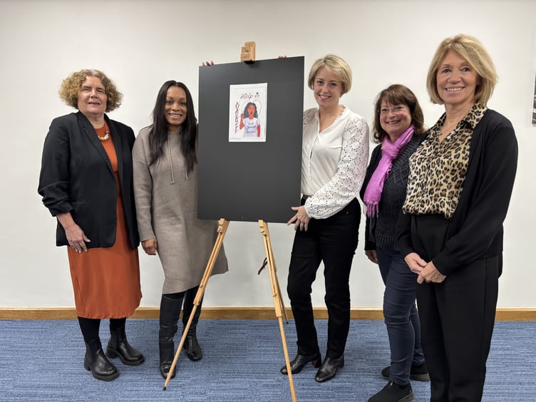 Help is available: The all-female panel behind Woking’s bold new domestic abuse awareness artwork.