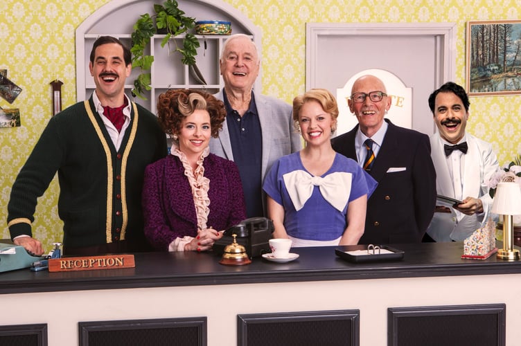 From left: Danny Bayne, Mia Austen, John Cleese, Joanne Clifton, Paul Nicholas and Hemi Yeroham, Fawlty Towers - The Play, G Live, Guildford, December 9th to 20th 2025.