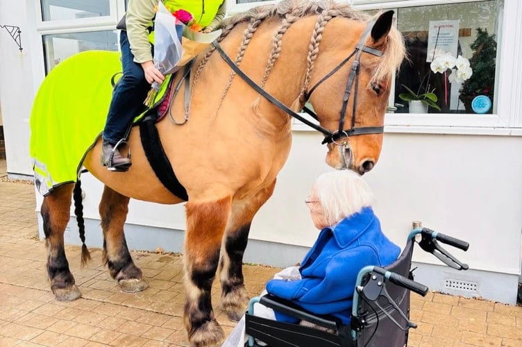 A lifelong animal lover, Joan poses with her favourite horse, Gasper.