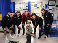 Christmas cardinals as Woking FC spread festive cheer off the pitch