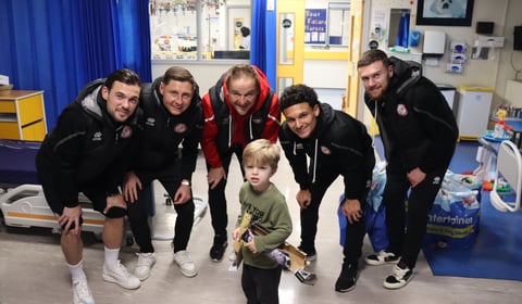 Christmas cardinals as Woking FC spread festive cheer off the pitch