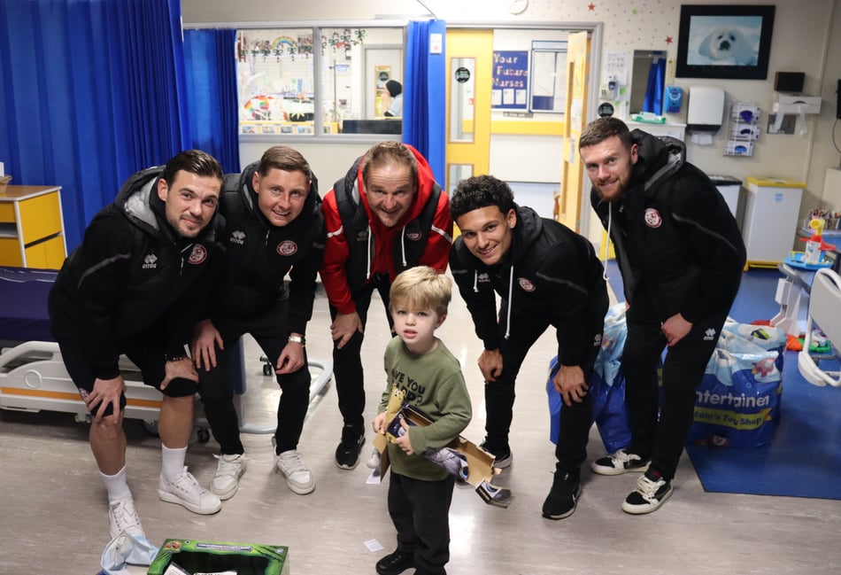 Christmas cardinals as Woking FC spread festive cheer off the pitch