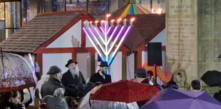 Crowds gather to honour historic menorah lighting