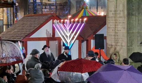 Crowds gather to honour historic menorah lighting