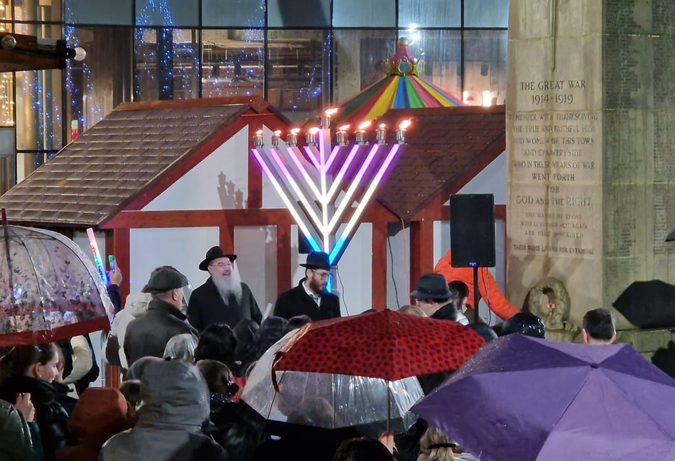 Crowds gather to honour historic menorah lighting