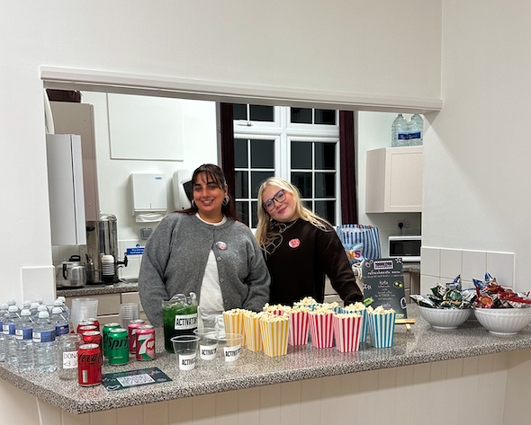 Volunteers prepare snacks and drinks for guests at a Femme Films screening, the new community cinema celebrating female-led films in Surrey.