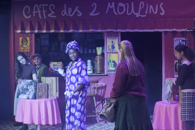 The wise painter Julienne Dueayel (Adekunbi Adebiyi), who encourages Amelie to pursue Nino. Also pictured (left to right) are: Katherine Ray Hill; Hamish Conduit; and Olivia Hansen.