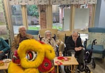 Dancing Lion roars into Woking as care home celebrates Chinese New Year