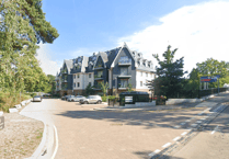 Car damaged and man assaulted by group near Woking apartments