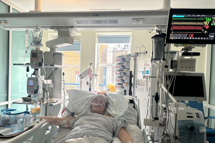 Jess Gibelli in hospital. // A young woman's stomach bug and bloating turned out to be a rare and aggressive form of blood cancer. Jess Gibelli, 28, started experiencing nausea, sickness, severe fatigue and bloating in November 2025 but she initially put it down to a sickness bug. She was working two physically demanding jobs as a florist and running her own event décor business - Viva La Fiesta - and she'd go straight to bed after work without having any dinner. But when her heart rate suddenly shot up to 160 while lying down in December 2025, Jess was rushed to hospital and doctors found a 30cm abdominal mass on an ultrasound.