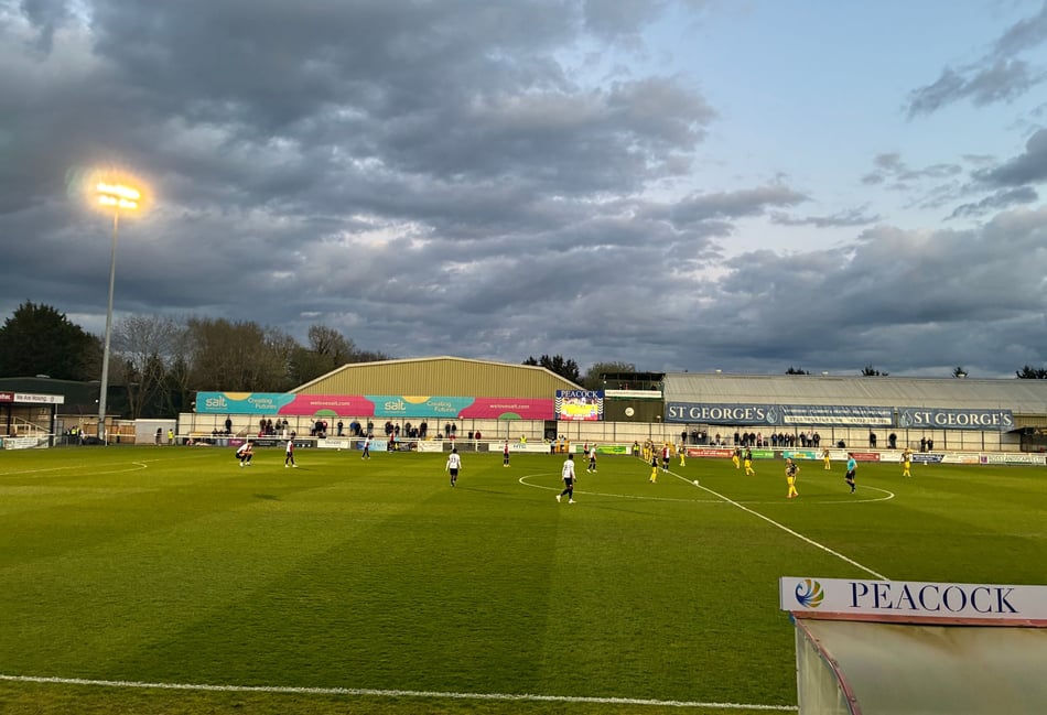 Woking come from behind to earn point at home to nine-man Altrincham