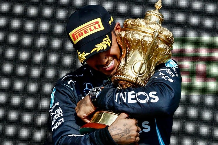 Sir Lewis Hamilton hugs the coveted Royal Automobile Club. Photo credit Brooklands Museum Trust