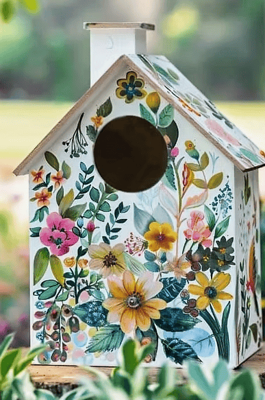 A hand-painted wooden birdhouse created as part of GIVE’s spring art workshop, designed to promote creativity, relaxation and wellbeing.