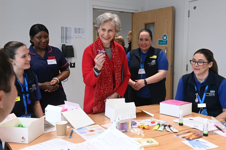 The Duchess of Gloucester unveils a commemorative plaque to officially open the Silverwood mental health unit in Chertsey.