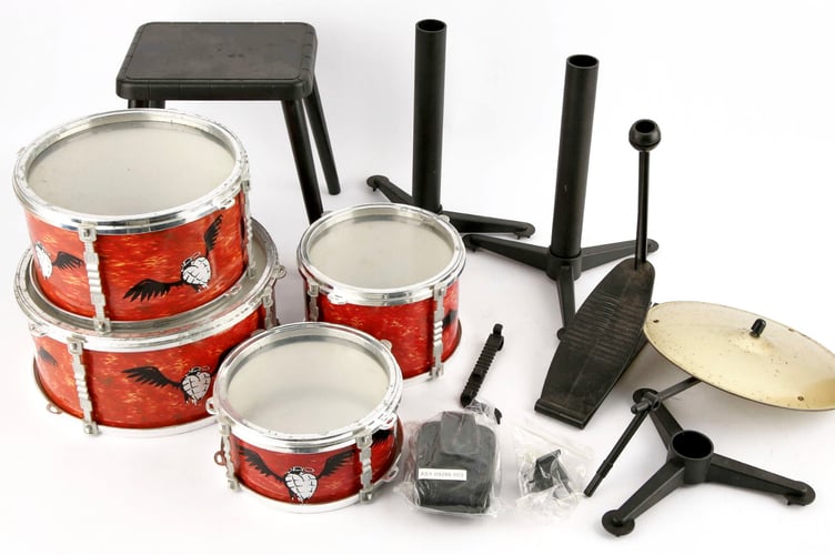 Green Day 'American Idiot' promotional children's toy drum kit: £100-200. // A top music industry executive is auctioning off a haul of memorabilia - including a Red Hot Chili Peppers surfboard. Korda Marshall - known as the 'A&R mans A&R man' - worked with huge names during his career including Muse, the Darkness and Gnarls Barkley. Now, as he completes work on the latest Blondie album, he is selling a large part of his personal collection at Ewbanks in Guildford, Surrey on April 29. Highlights include super rare acetate recordings and signed white label records from key rock and pop moments of the last 40 years. Among the gold, silver and platinum discs, Kordas most treasured consignment is a Red Hot Chili Peppers surfboard, a promotional item for their ninth studio album, Stadium Arcadium. It has an estimate of £200-400. All lots, often each containing collections of vinyl LPs, are priced under £1,000.