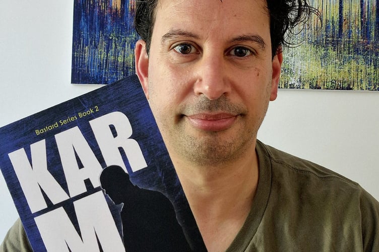 Woking author Damiano Polcaro with his new crime novel, Karma.