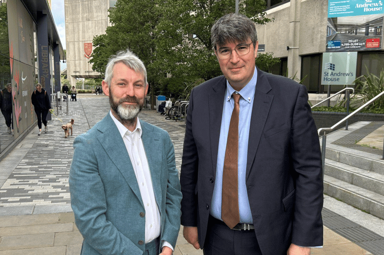 Woking MP Will Forster with Cllr Paul Follows, the new leader of West Surrey Council.