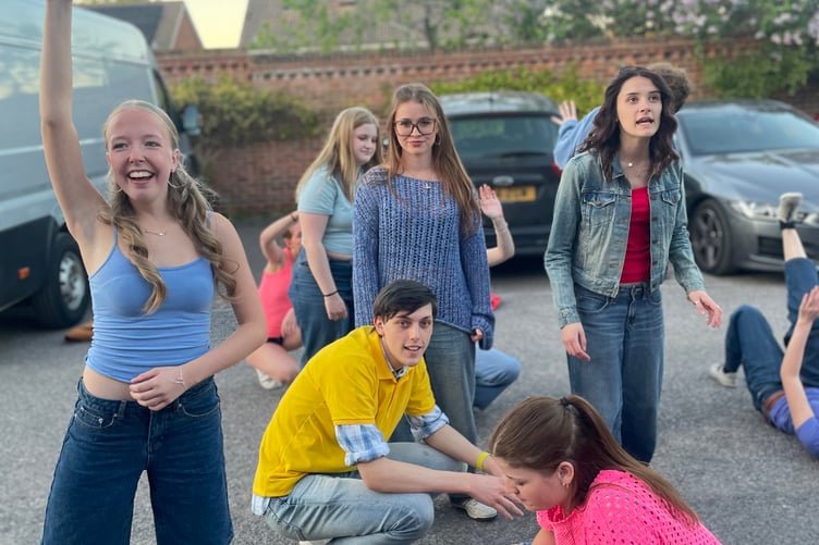 Practice makes perfect: the company rehearse in the car park before the Maidenhead Drama Festival