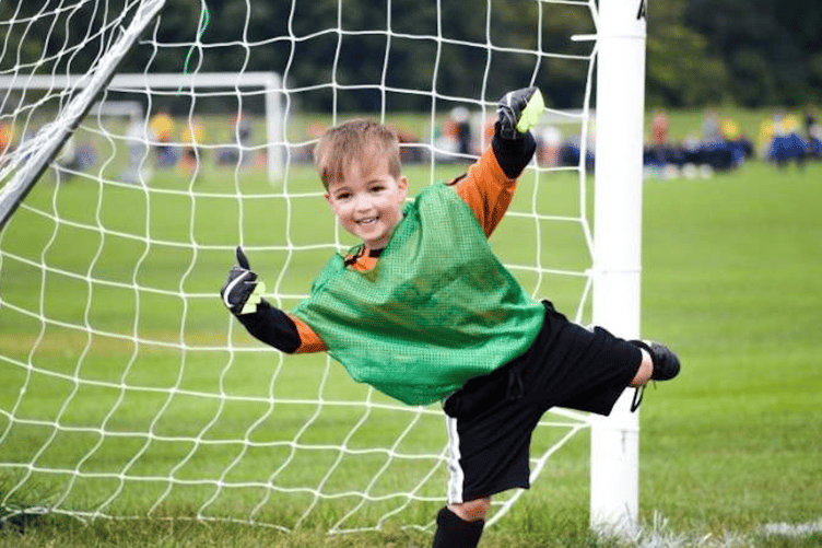 Boy playing football.