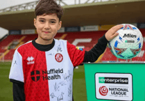 Chance to lead players on to Woking pitch as mascot