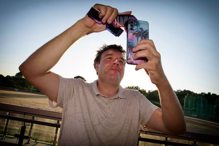 Jon Andrews tries to capture the eclipse. Picture: Richard Lea.