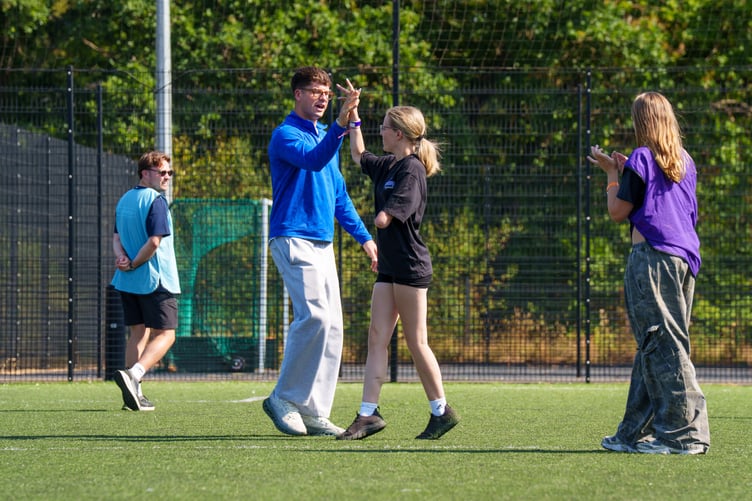 Attendees and volunteers playing walking football.