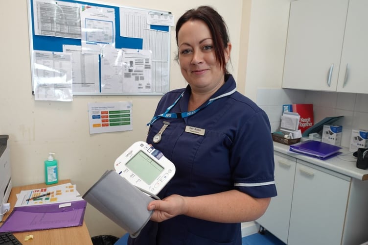 Nurse with blood pressure monitor