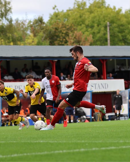 John Marquis fires Woking 3-0 up from the penalty spot (Photo: Phil Fiddes)