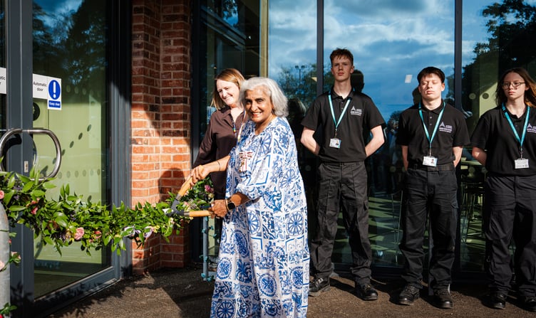 HM Lord-Lieutenant of Surrey Neelam Dharni Devesher MBE cuts the garland to formally open the new Norman Shaw Building at Merrist Wood College