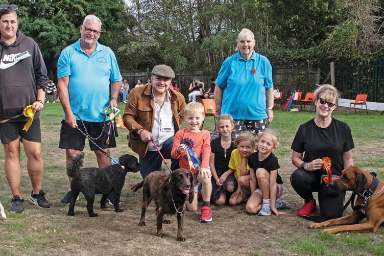 Fun dog show judge Patricia Knowles, second right, with the winners of the Dog I'd Like To Take Home class.