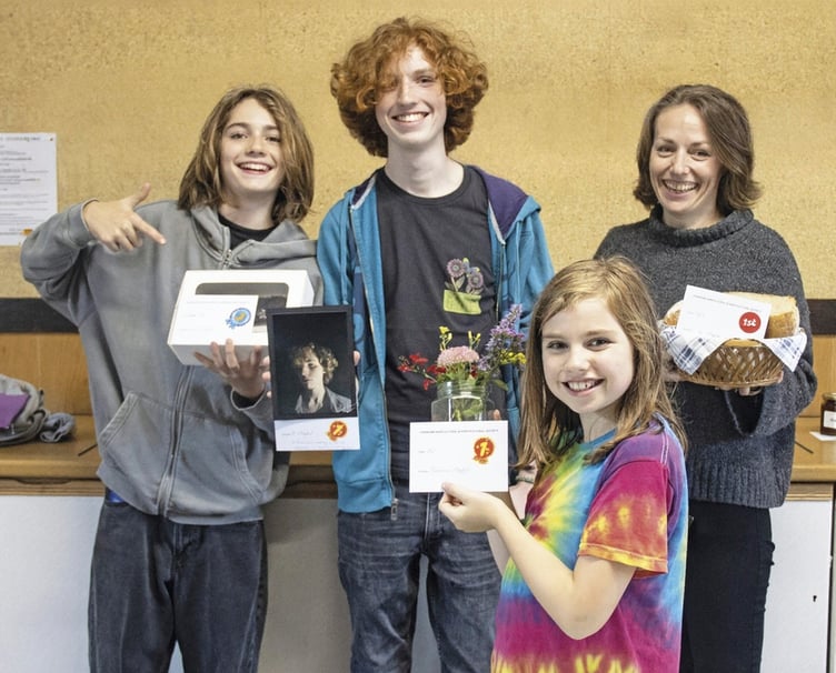 The Moqbel family were all winners at the show, mum Amy leading the way with her prize sourdough loaf. She is pictured with, from left, Evan, Tom and Jazzy.